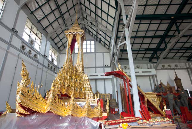 Thai army officers work on a platform next to the Great Victory Royal Chariot or Phra Maha Phichai Ratcharot, which will be used to carry the body and the royal urn of the late Thai King Bhumibol Adulyadej in the royal cremation ceremony, at the National Museum in Bangkok, Thailand, 13 September 2017 (issued 14 September 2017). The royal cremation of King Bhumibol is scheduled for 26 October 2017, and the funeral will consist of a five-day rites ceremony. King Bhumibol died at the age of 88 in Siriraj hospital on 13 October 2016 after 70 years on the throne. EPA-EFE/RUNGROJ YONGRIT