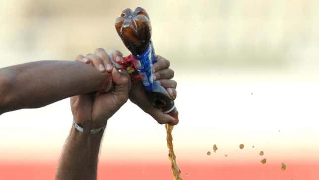 A bottle of Pepsi gets poured out.