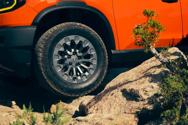 Front wheel of an orange 2026 Honda Passport TrailSport