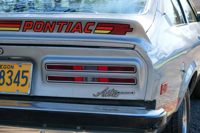 A close-up of the back end of the Astre showing the Pontiac graphic on the spoiler and the Astre badge