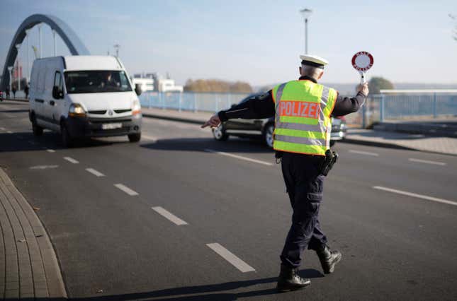 FILE - A officer of German Federal Police stops a van to search for immigrants at the border crossing from Poland into Germany in Frankfurt an der Oder, Germany, Oct. 28, 2021. Germany will increase its police patrols along &quot;smuggling routes&quot; on the border with Poland the Czech Republic in an effort to prevent more migrants from entering the country, it was announced Wednesday, Sept. 27, 2023. (AP Photo/Markus Schreiber, File)