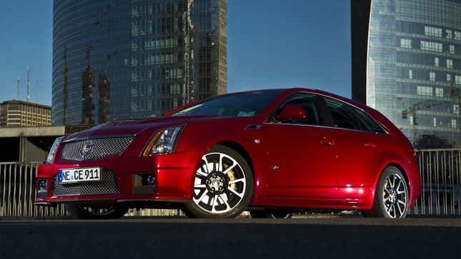 A photo of a red Cadillac station wagon. 