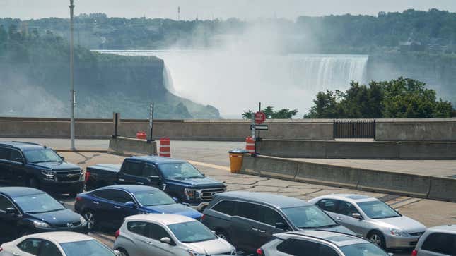 Travelers wait to cross into Canada at the Rainbow Bridge in Niagara Falls, Ontario, August 9, 2021 as Canada reopened for nonessential travel to fully vaccinated Americans. 