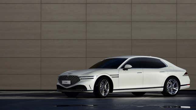 A photo of a white 2023 Genesis G90 sedan. 