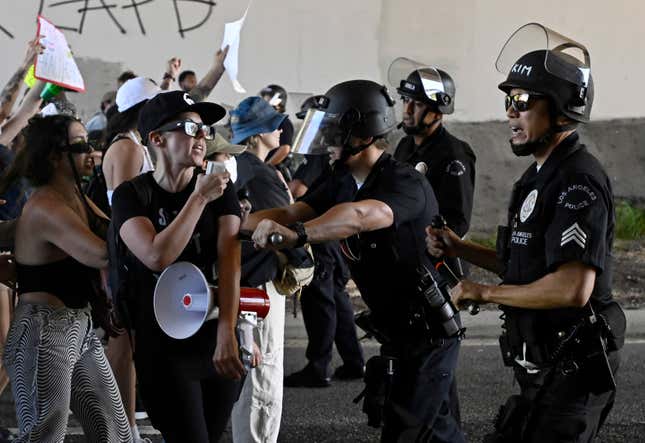 Los Angeles Police Department officers push with activists as they  attempt to walk onto the 110 Freeway at Broadway as they protest the  U.S. Supreme Court’s overturning of Roe v. Wade in Los Angeles, on  Saturday, June 25, 2022. 