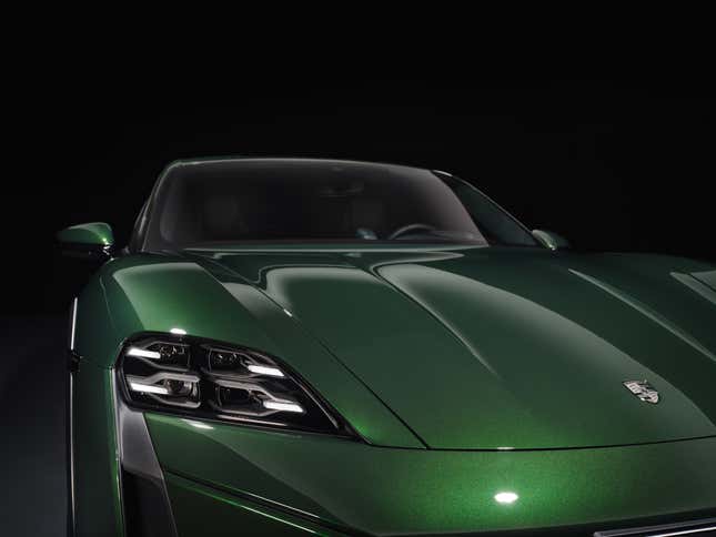 Headlights and hood of a green 2025 Porsche Taycan Cross Turismo