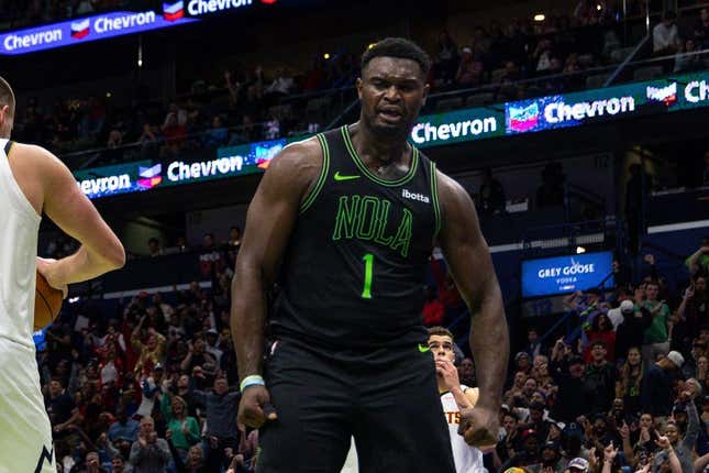 Nov 17, 2023; New Orleans, Louisiana, USA; New Orleans Pelicans forward Zion Williamson (1) reacts to making a basket and being fouled by Denver Nuggets center Nikola Jokic (15) during the second half at the Smoothie King Center.
