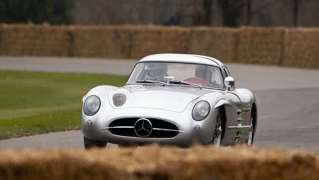 A photo of a Mercedes 300SLR on track. 