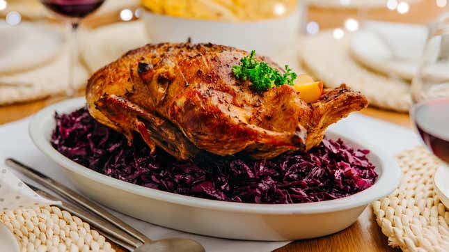 Roast duck on a bed of red cabbage.