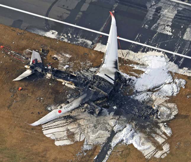 FILE - This aerial photo show the burn-out Japan Airlines plane at Haneda airport in Tokyo, on Jan. 3, 2024. The 379 passengers of Japan Airlines Flight JAL-516 didn&#39;t expect their plane to burst into flames just as it was about to touchdown at Tokyo’s Haneda airport Tuesday evening. A smaller coast guard Bombardier Dash-8 aircraft, preparing to take off to deliver urgent aid to quake-hit central Japan, was using the same runway when the two collided. The Associated Press collected accounts from witnesses, officials and transcripts of the traffic controls communication. (Kyodo News via AP, File)