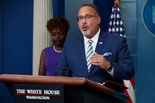 WASHINGTON, DC - JUNE 30: White House Press Secretary Karine Jean-Pierre (L) and Education Secretary Miguel Cardona talk to reporters during the daily news conference in the Brady Press Briefing Room at the White House on June 30, 2023 in Washington, DC. Cardona fielded questions about recent U.S. Supreme Court decision blocking President Joe Biden’s program to forgive billions of dollars in student loan debt.