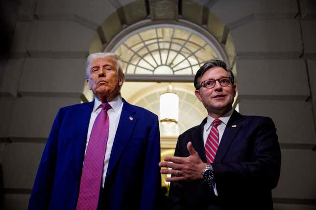 Speaker of the House Mike Johnson (R-LA) (R), accompanied by U.S. President Donald Trump, speaks to members of the media as they depart a House Republican meeting at the U.S. Capitol on May 20, 2025 in Washington, DC. Trump joined conservative House lawmakers to help push through their budget bill after it advanced through the House Budget Committee on Sunday evening.