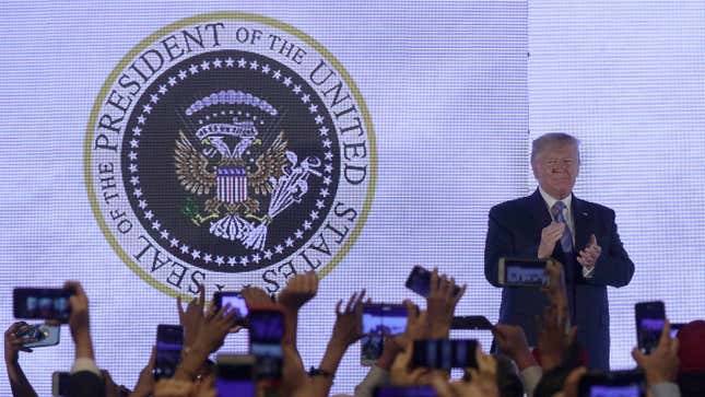 Image for article titled Trump Gives Speech in Front of Altered Presidential Seal Featuring Golf Clubs and ‘45 Is a Puppet’