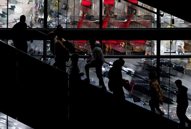 FILE - Shoppers walk up and down the stairs in a Nike store on Black Friday, Nov. 25, 2022, in New York. Mistakes during the holiday season can be detrimental to a business’s bottom line — but small-business owners still have time to put themselves in the best position for success. To avoid common holiday mistakes, business owners should plan ahead and use historical data to anticipate their seasonal needs. (AP Photo/Julia Nikhinson, File)