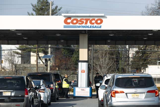 Cars line up at a Costco gas station in Bayonne, New Jersey, US, on Saturday, Dec. 9, 2023. 