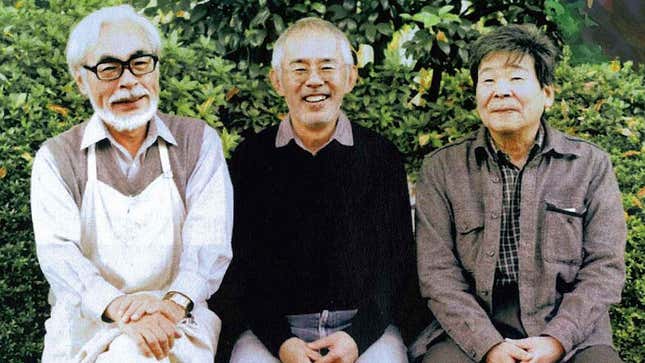 Miyazaki, Suzuki, and Takahata sit on a bench