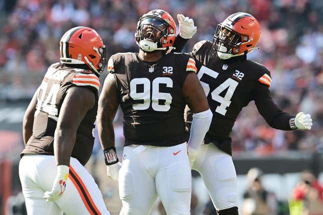 Nov 5, 2023; Cleveland, Ohio, USA; Cleveland Browns defensive tackle Jordan Elliott (96) celebrates a sack with defensive tackle Dalvin Tomlinson (94) and defensive end Ogbo Okoronkwo (54) during the first quarter against the Arizona Cardinals at Cleveland Browns Stadium.