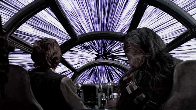 Han Solo and Chewbacca look out of the cockpit of the Millennium Falcon, as it accelerates to Lightspeed in preparation to jump into Hyperspace.