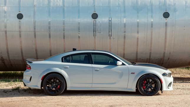 A photo of a white Dodge Charger sedan. 