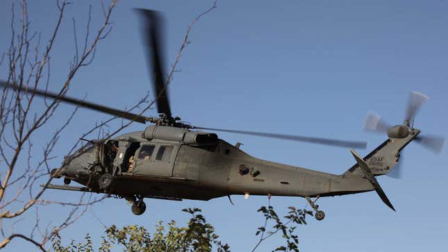 A photo of a Black Hawk helicopter flying. 