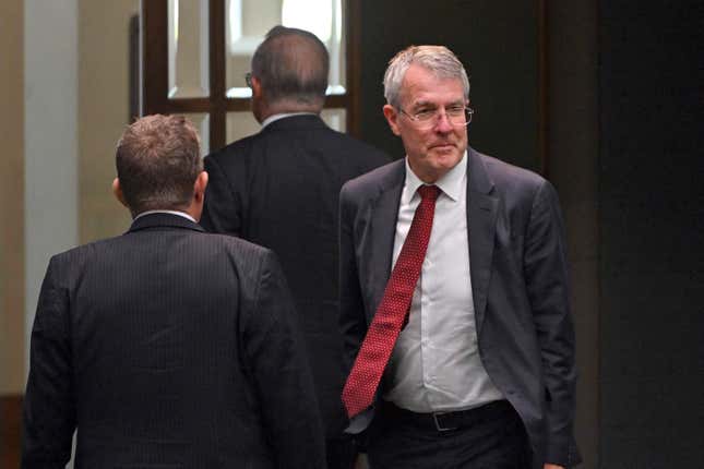 Australia&#39;s Attorney-General Mark Dreyfus leaves the house of representatives at Parliament House in Canberra, Tuesday, Feb. 13, 2024. The Australian government said on Tuesday it will outlaw doxxing – the malicious release online of personal or identifying information without the subject’s permission – after pro-Palestinian activists published personal details of hundreds of Jewish people in Australia.(Mick Tsikas/AAP Image via AP)