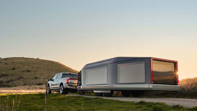 A photo of a Ford truck pulling the Lightship camper. 