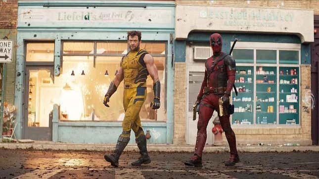 Wolverine and Deadpool walk down a street