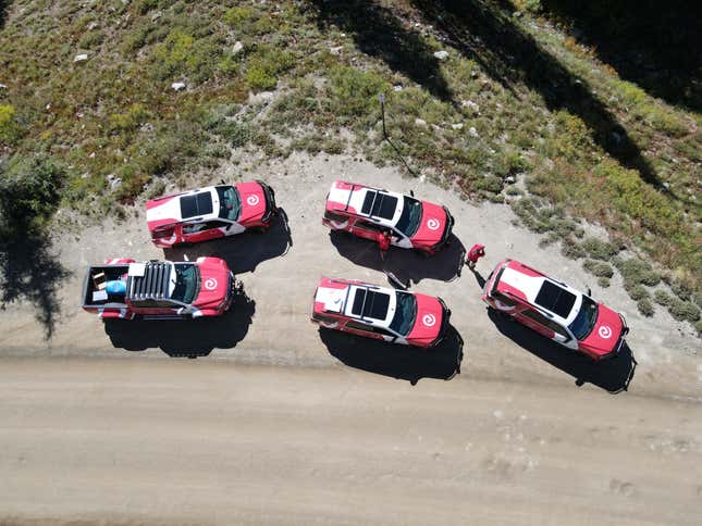 Overhead view of four F-150s and a Ford F-350