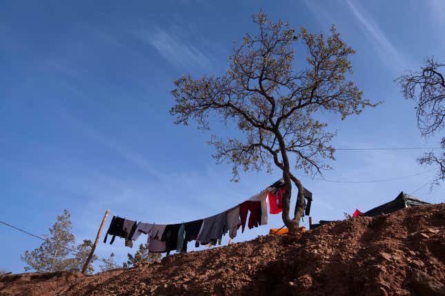 Laundry belonging to people who were displaced by the earthquake is put out against a tree in Ouirgane, outside Marrakech, Saturday, Oct. 7, 2023. Villagers in hard-hit regions are weighing how to best rebuild as Moroccan authorities begin to providing rehousing funds to those whose homes were destroyed by last month&#39;s earthquake. (AP Photo/Mosa&#39;ab Elshamy)