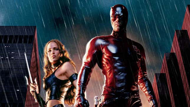 Elektra (left) and Daredevil (right) stand in the rain in this poster for the 2003 Daredevil film.
