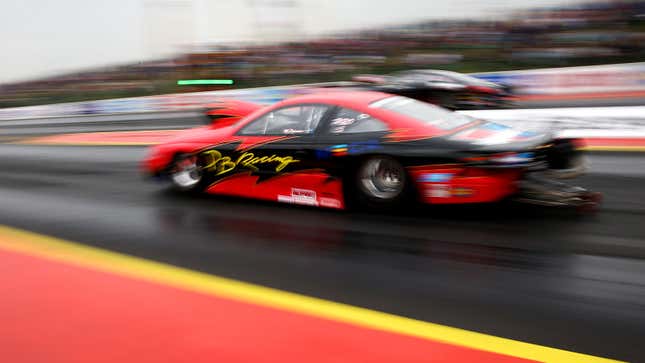 A photo of a drag racer on the track. 