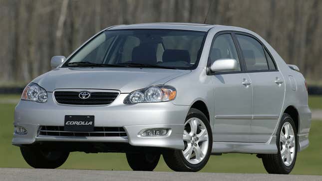 A photo of a silver Toyota Corolla sedan. 