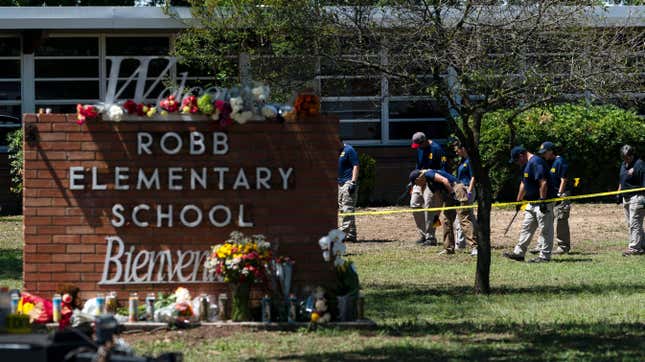 FILE - Investigators search for evidences outside Robb Elementary School in Uvalde, Texas, May 25, 2022, after an 18-year-old gunman killed 19 students and two teachers. Uvalde Consolidated Independent School District Police Chief Pete Arredondo, who served as on-site commander during the shooting, said that he's talking daily with investigators, contradicting claims from state law enforcement that he has stopped cooperating. (AP Photo/Jae C. Hong, File)