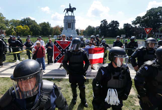 BY ANY MEANS NECESSARY: Virginians far and wide stand and protect the statue of Confederate General Robert E. Lee. This a Sept 2017 image on Monument Avenue in Richmond, Va.