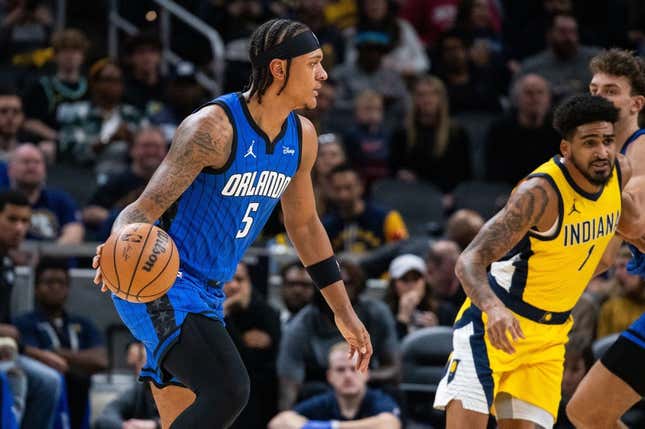 Nov 19, 2023; Indianapolis, Indiana, USA; Orlando Magic forward Paolo Banchero (5) dribbles the ball in the first quarter against the Indiana Pacers at Gainbridge Fieldhouse.