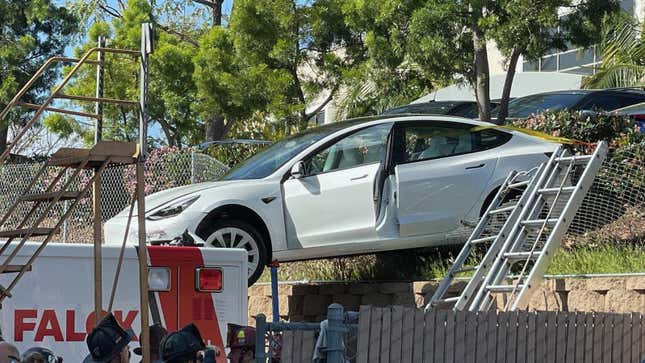 Image for article titled A Tesla Model 3 Crashed And Landed On Top Of An Ambulance