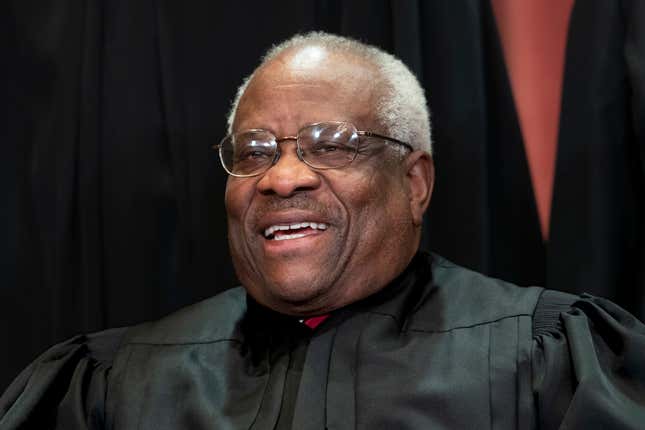 In this Nov. 30, 2018 photo, Supreme Court Associate Justice Clarence Thomas sits for a group portrait at the Supreme Court Building in Washington.