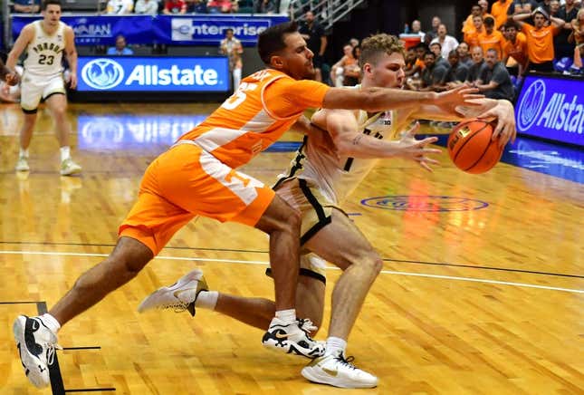 Nov 21, 2023; Honolulu, HI, USA; Tennessee Volunteers guard Santiago Vescovi (25) and Purdue Boilermakers forward Caleb Furst (1) fight for the ball during the second period at SimpliFi Arena at Stan Sheriff Center.