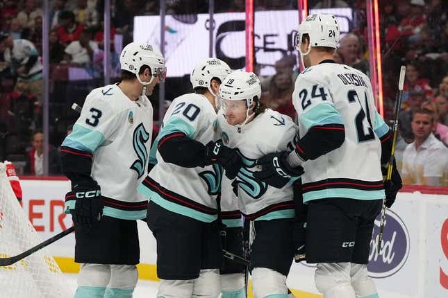 Oct 28, 2023; Sunrise, Florida, USA; Seattle Kraken left wing Jared McCann (19) celebrates his goal against the Florida Panthers with teammates on the ice during the first period at Amerant Bank Arena.