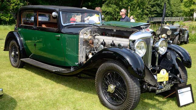 A green and black Bentley 8-Litre Saloon