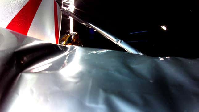 An in-space photo of Peregrine showing damage to the spacecraft’s insulation layer.