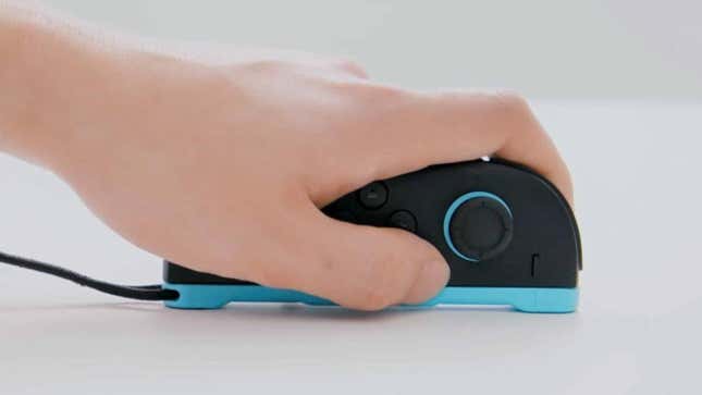 A hand moves a Joy-Con like a mouse.