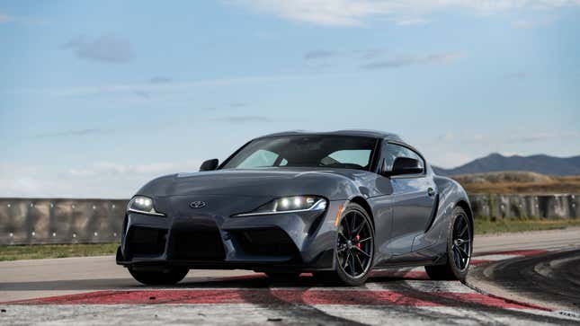 A photo of a dark grey Toyota Supra sports car. 