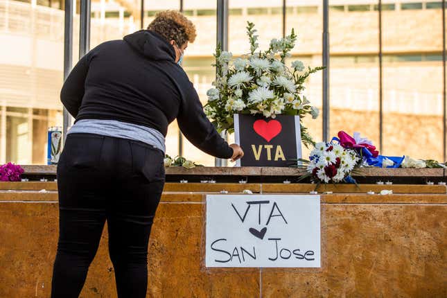 HERO Tent President Kiana Simmons tends to a vigil organized by her group following the mass shooting at the Valley Transportation Authority (VTA) light-rail yard, outside City Hall on May 26, 2021 in San Jose, California. A VTA employee opened fire at the yard, with preliminary reports indicating nine people dead including the gunman. 