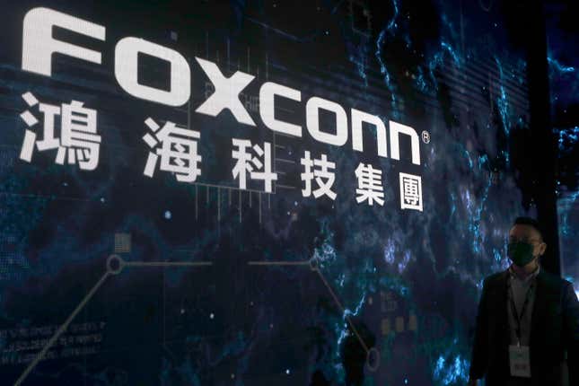 FILE - The Foxconn logo is seen during the Hon Hai Tech Day at the Nangang Exhibition Center in Taipei, Taiwan, on Oct. 18, 2022. Foxconn, a Fortune 500 company known globally for making Apple iPhones, was recently subjected to searches by Chinese tax authorities, state media reported Sunday, Oct. 22, 2023. (AP Photo/Chiang Ying-ying, File)