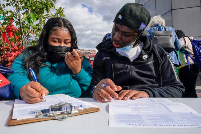 Residents of the Flatbush neighborhood of the Brooklyn borough of New York register to vote at a voter registration event on Sept. 29, 2021.