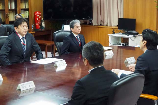 Tokyo Electric Power Company Holdings (TEPCO) President Tomoaki Kobayakawa, left, holds a meeting with Japan&#39;s Industry Minister Ken Saito, right, at the Ministry of Economy, Trade and Industry in Tokyo Wednesday, Feb. 21, 2024. Japan’s industry minister summoned the president of the utility that runs the Fukushima nuclear power plant to his office Wednesday and chided him for a radioactive water leak at the plant earlier this month. (Kyodo News via AP)