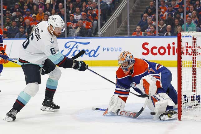 Nov 15, 2023; Edmonton, Alberta, CAN; Edmonton Oilers goaltender Stuart Skinner (74) makes a save on a shot by Seattle Kraken defensemen Adam Larsson (6) during the second period at Rogers Place.