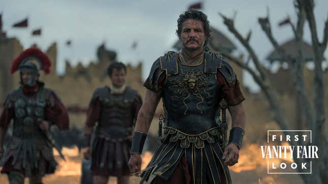 Pedro Pascal walks towards the camera in a gladiator costume.