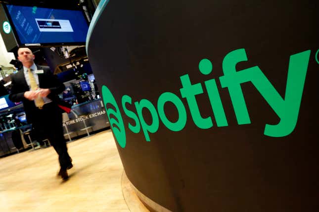 FILE - A trading post sports the Spotify logo on the floor of the New York Stock Exchange, Tuesday, April 3, 2018. Spotify said Monday, Dec. 4, 2023 it&#39;s axing 17% of its global workforce, in the music streaming service&#39;s third round of layoffs this year as it tries to slash costs while focusing on profitabilty. (AP Photo/Richard Drew, File)